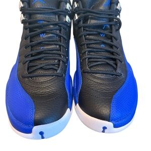Woman’s Air Jordan’s Royal Blue and Black High-Top Sneakers. Woman’s Size 9